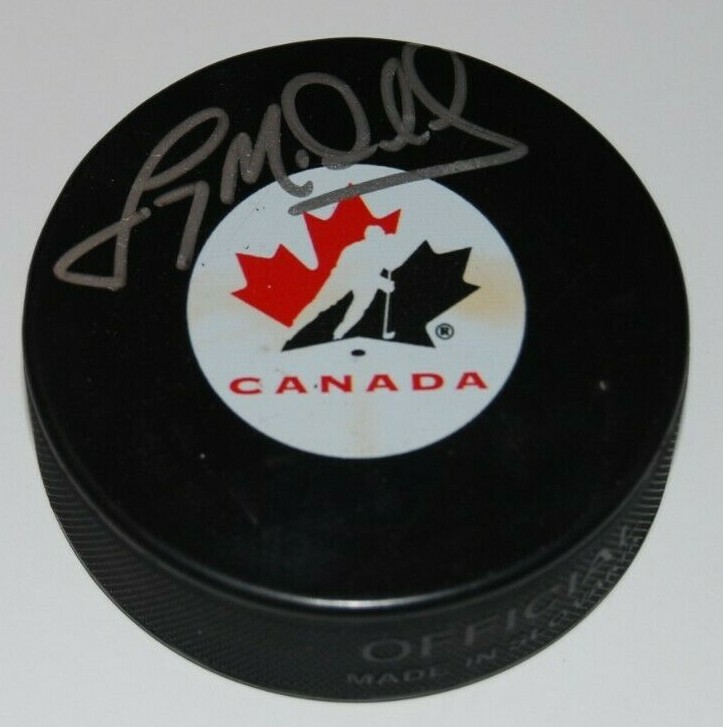 LANNY MCDONALD signed (TORONTO MAPLE LEAFS) Team Canada NHL HOCKEY Puck W/COA Collectible Memorabilia