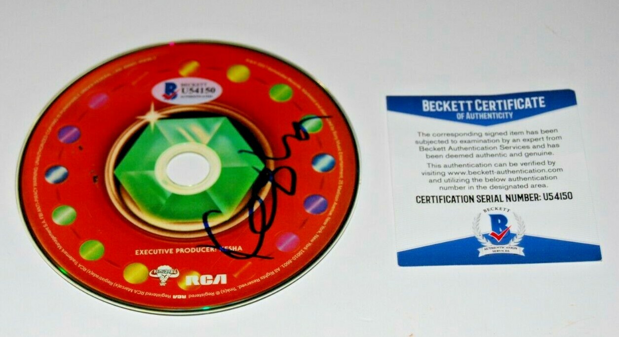 KESHA signed (RAINBOW) CD *FULL NAME* W/COA *KE$HA*autographed (PRAYING) BECKETT Collectible Memorabilia