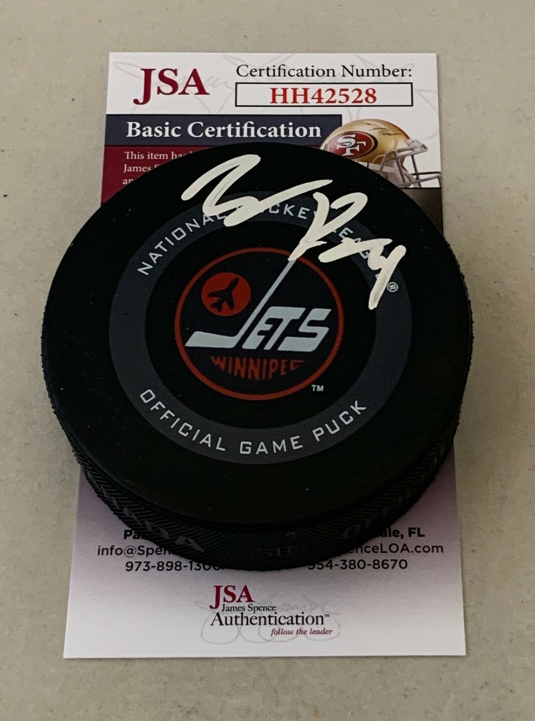 Neal Pionk signed Winnipeg Jets 3rd Jersey Game Puck autographed JSA Collectible Memorabilia