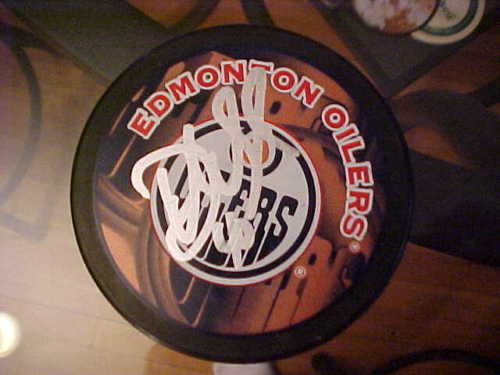 EDMONTON OILERS DEVAN DUBNYK SIGNED PUCK Collectible Memorabilia