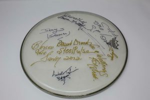 STEEL PULSE FULL BAND (X8) SIGNED AUTOGRAPH STAGE USED DRUMHEAD – CONCERT USED  COLLECTIBLE MEMORABILIA