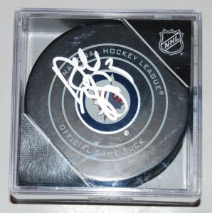 DUSTIN BYFUGLIEN SIGNED (WINNIPEG JETS) OFFICIAL GAME HOCKEY PUCK W/COA  COLLECTIBLE MEMORABILIA
