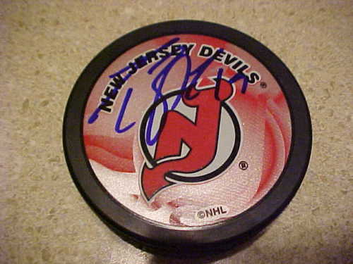 NEW JERSEY DEVILS TRAVIS ZAJAC SIGNED PUCK Collectible Memorabilia