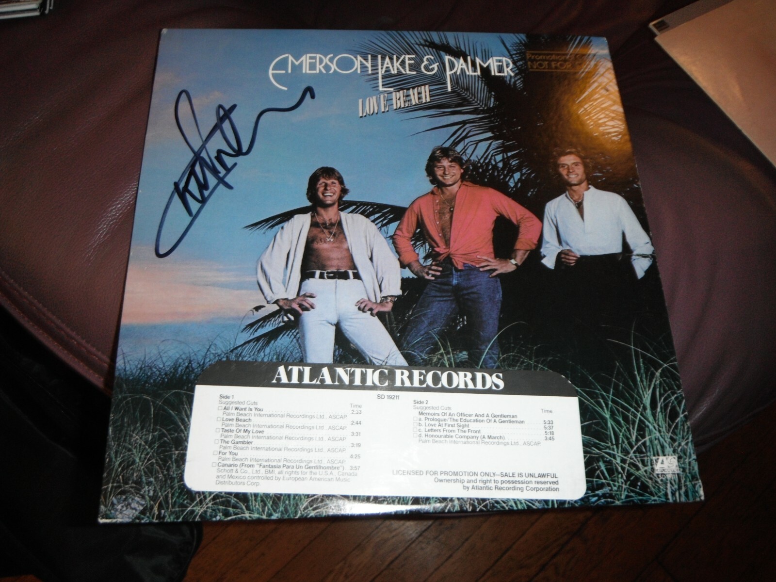 EMERSON LAKE AND PALMER SIGNED LOVE BEACH VINYL ALBUM BY CARL PALMER Collectible Memorabilia