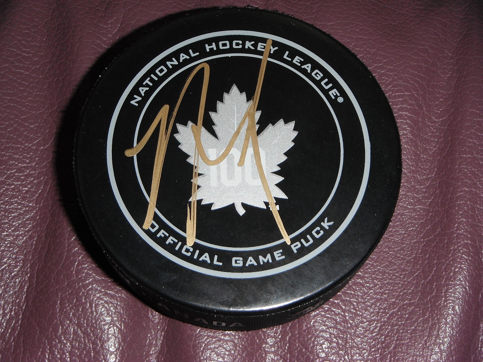 TORONTO MAPLE LEAFS NAZEM KADRI SIGNED 100TH ANNIVERSARY GAME PUCK Collectible Memorabilia