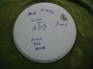 THE DAN BAND GROUP SIGNED DRUMHEAD WITH INSCRIPTIONS  COLLECTIBLE MEMORABILIA