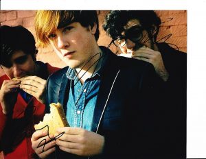 TWO DOOR CINEMA CLUB GROUP SIGNED EATING SANDWICHES 8X10  COLLECTIBLE MEMORABILIA