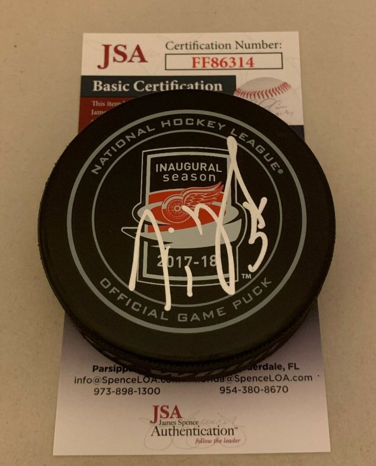 JIMMY HOWARD SIGNED DETROIT RED WINGS 2017 – 2018 LCA INAUGURAL GAME PUCK JSA  COLLECTIBLE MEMORABILIA