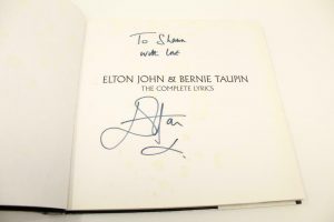 ELTON JOHN SIGNED AUTOGRAPH “THE COMPLETE LYRICS” BOOK – W/ BERNIE TAUPIN, RARE  COLLECTIBLE MEMORABILIA