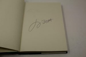 JIMMY BUFFETT SIGNED AUTOGRAPH “WHERE IS JOE MERCHANT” BOOK – MARGARITAVILLE  COLLECTIBLE MEMORABILIA