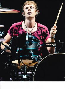 THE MUSE DRUMMER DOMINIC HOWARD SIGNED ON THE SET 8X10  COLLECTIBLE MEMORABILIA