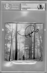 TAYLOR SWIFT SIGNED FOLKLORE CD COVER W/BECKETT BAS COA SLAB SLABBED AUTHENTIC F  COLLECTIBLE MEMORABILIA