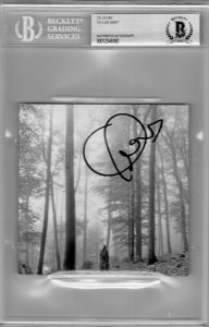 TAYLOR SWIFT SIGNED FOLKLORE CD COVER W/BECKETT BAS COA SLAB SLABBED AUTHENTIC G  COLLECTIBLE MEMORABILIA