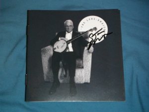 STEVE MARTIN SIGNED LONG AWAITED ALBUM CD COVER SITTING IN COUCH WITH BANJO  COLLECTIBLE MEMORABILIA