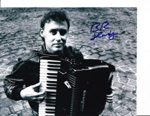 BRUCE HORNSBY SIGNED POSED WITH ACCORDION 8X10  COLLECTIBLE MEMORABILIA