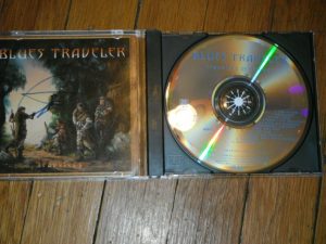BLUES TRAVELER JOHN POPPER SIGNED TRAVELERS AND THIEVES CD COVER  COLLECTIBLE MEMORABILIA