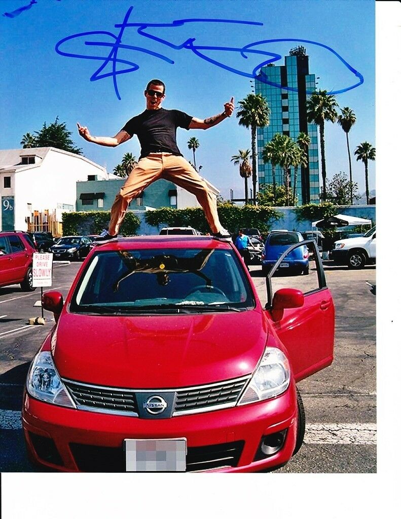 JACKASS STEVEO SIGNED 8X10 ON THE ROOF OF A CAR Collectible