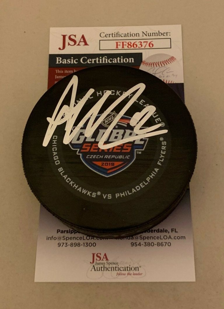 ALEX DEBRINCAT CHICAGO BLACKHAWKS SIGNED 2019 GLOBAL SERIES GAME PUCK HAWKS JSA  COLLECTIBLE MEMORABILIA