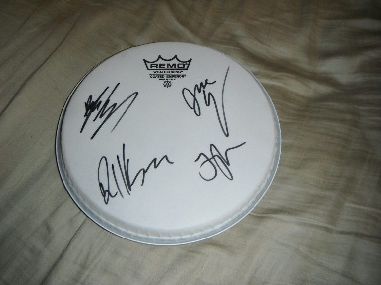 THE KONGOS GROUP SIGNED DRUMHEAD ALL FOUR MEMBERS  COLLECTIBLE MEMORABILIA