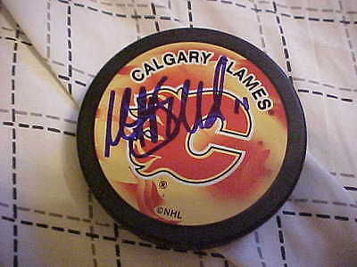 CALGARY FLAMES MIKAEL BACKLUND SIGNED SOUVENIR HOCKEY PUCK  COLLECTIBLE MEMORABILIA