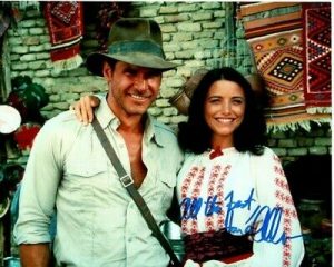 KAREN ALLEN SIGNED AUTOGRAPHED RAIDERS OF THE LOST ARK W/ HARRISON FORD PHOTO COLLECTIBLE MEMORABILIA