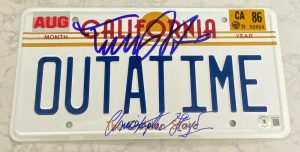 MICHAEL J FOX CHRISTOPHER LLOYD “BACK TO THE FUTURE” SIGNED LICENSE PLATE BAS A COLLECTIBLE MEMORABILIA