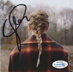 TAYLOR SWIFT “EVERMORE” AUTOGRAPH SIGNED CD BOOKLET + CD ACOA COLLECTIBLE MEMORABILIA