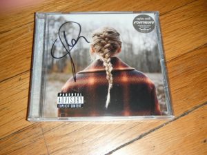 TAYLOR SWIFT SIGNED EVERMORE CD COVER