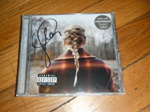 TAYLOR SWIFT SIGNED EVERMORE CD COVER STILL SEALED COLLECTIBLE MEMORABILIA