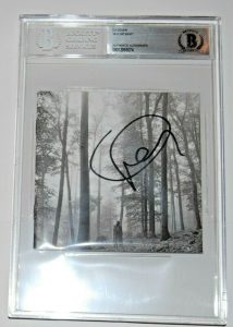 TAYLOR SWIFT SIGNED (FOLKLORE) CD COVER BECKETT ENCAPSULATED BAS 00012895074 COLLECTIBLE MEMORABILIA
