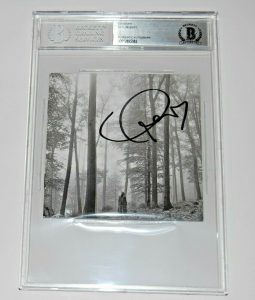 TAYLOR SWIFT SIGNED (FOLKLORE) CD COVER BECKETT ENCAPSULATED BAS 00012895082 COLLECTIBLE MEMORABILIA