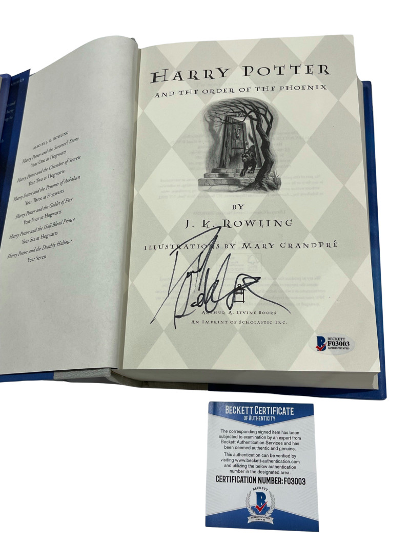 DANIEL RADCLIFFE SIGNED HARRY POTTER AND THE ORDER OF THE PHOENIX BOOK BECKETT A