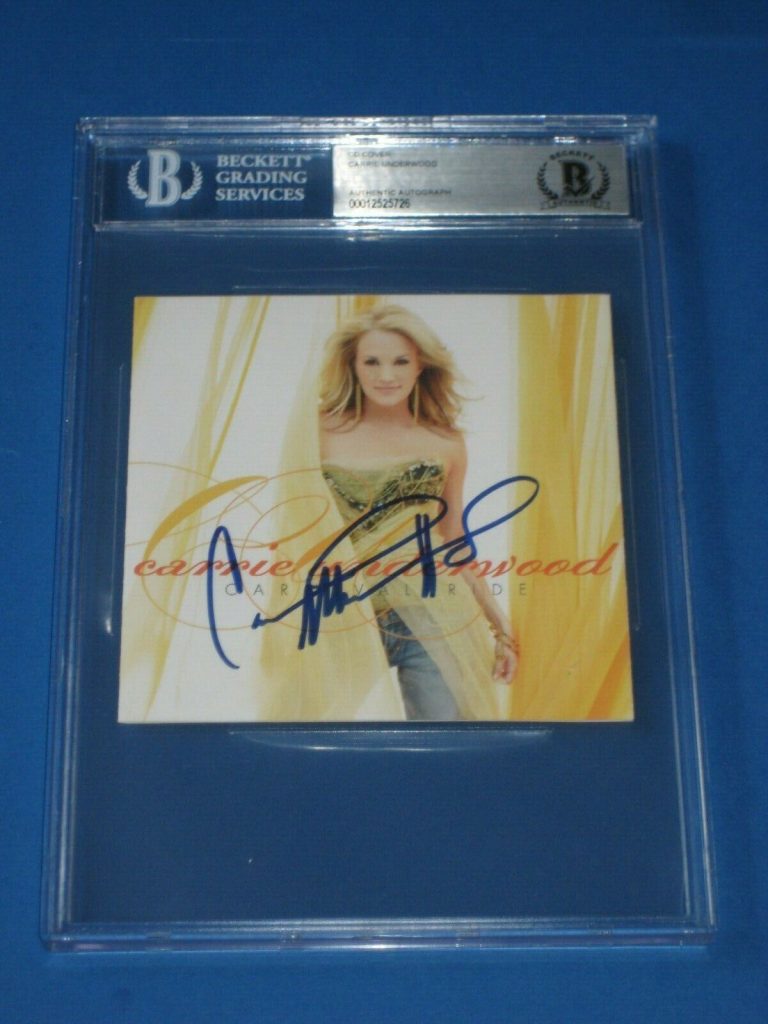 CARRIE UNDERWOOD SIGNED CARNIVAL RIDE CD COVER BECKETT AUTHENTICATED & ENCAP COLLECTIBLE MEMORABILIA
