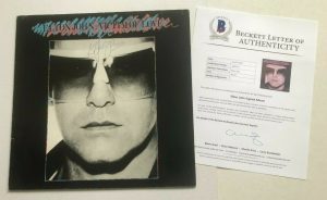 ELTON JOHN SIGNED VICTIM OF LOVE LP ALBUM COVER W/ BECKETT BAS LOA COLLECTIBLE MEMORABILIA