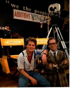 HUEY LEWIS SIGNED 8×10 BACK TO THE FUTURE W/ MICHAEL J. FOX PHOTOGRAPH – TO JOHN COLLECTIBLE MEMORABILIA