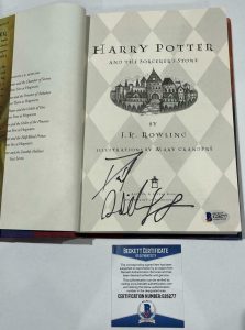 DANIEL RADCLIFFE SIGNED HARRY POTTER AND THE SORCERER’S STONE BOOK BECKETT 23 COLLECTIBLE MEMORABILIA