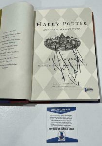 DANIEL RADCLIFFE SIGNED HARRY POTTER AND THE SORCERER’S STONE BOOK BECKETT 49 COLLECTIBLE MEMORABILIA