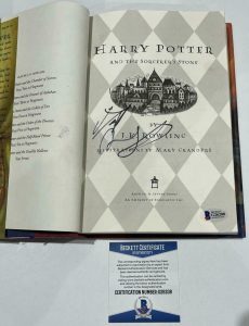 DANIEL RADCLIFFE SIGNED HARRY POTTER AND THE SORCERER’S STONE BOOK BECKETT 56 COLLECTIBLE MEMORABILIA