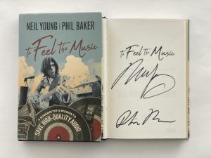 NEIL YOUNG SIGNED AUTOGRAPH “TO FEEL THE MUSIC” BOOK – CRAZY HORSE RARE W/ BAS COLLECTIBLE MEMORABILIA