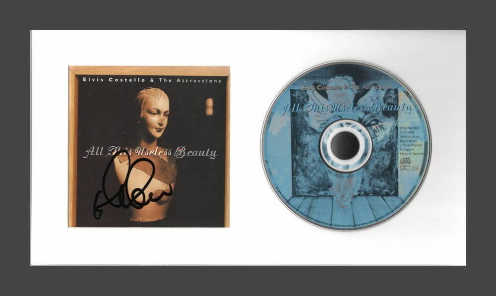 ELVIS COSTELLO SIGNED AUTOGRAPH ALL THIS USELESS BEAUTY CD DISPLAY READY TO HANG