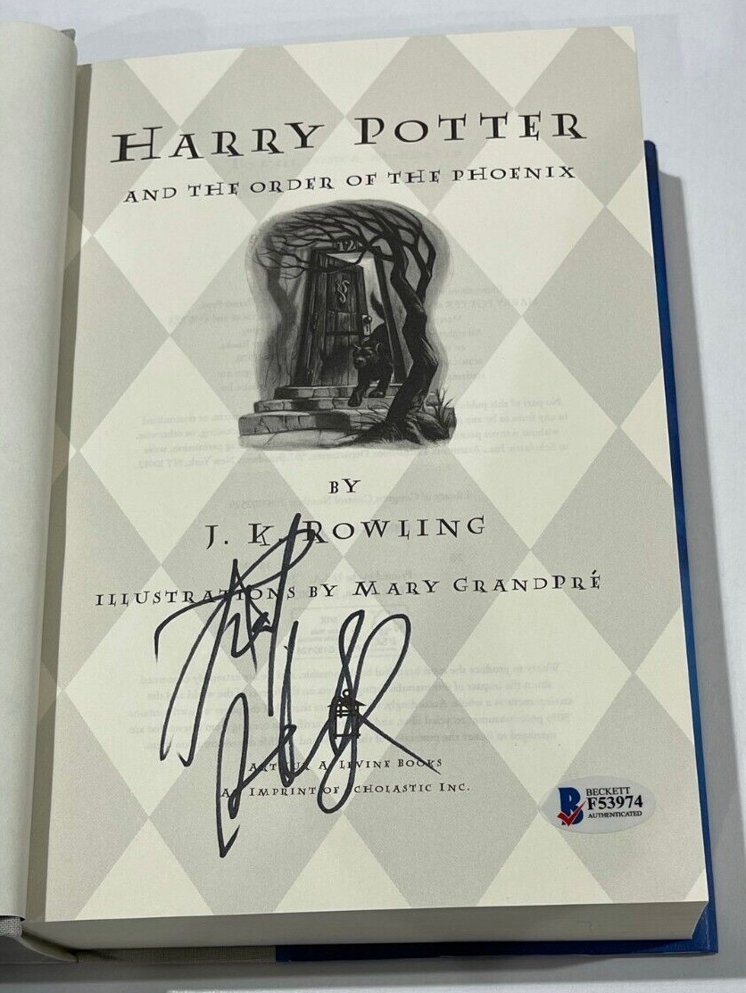 DANIEL RADCLIFFE SIGNED HARRY POTTER AND THE ORDER OF THE PHOENIX BOOK BECKETT 9