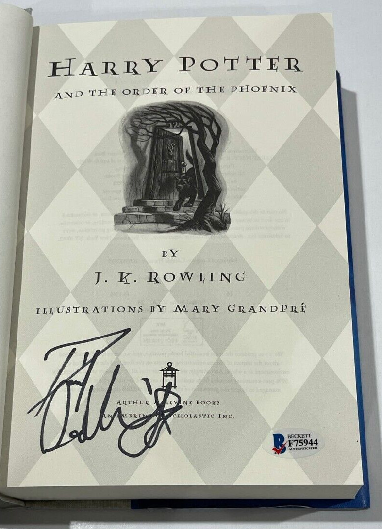 DANIEL RADCLIFFE SIGNED HARRY POTTER AND THE ORDER OF THE PHOENIX BOOK BECKETT E