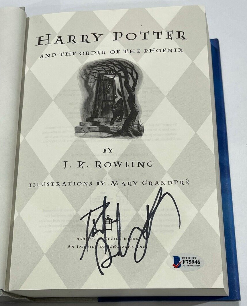 DANIEL RADCLIFFE SIGNED HARRY POTTER AND THE ORDER OF THE PHOENIX BOOK BECKETT E