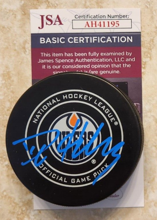 Dylan Holloway Signed Official NHL Game Puck w/ JSA COA #AH41195 Edmonton Oilers
