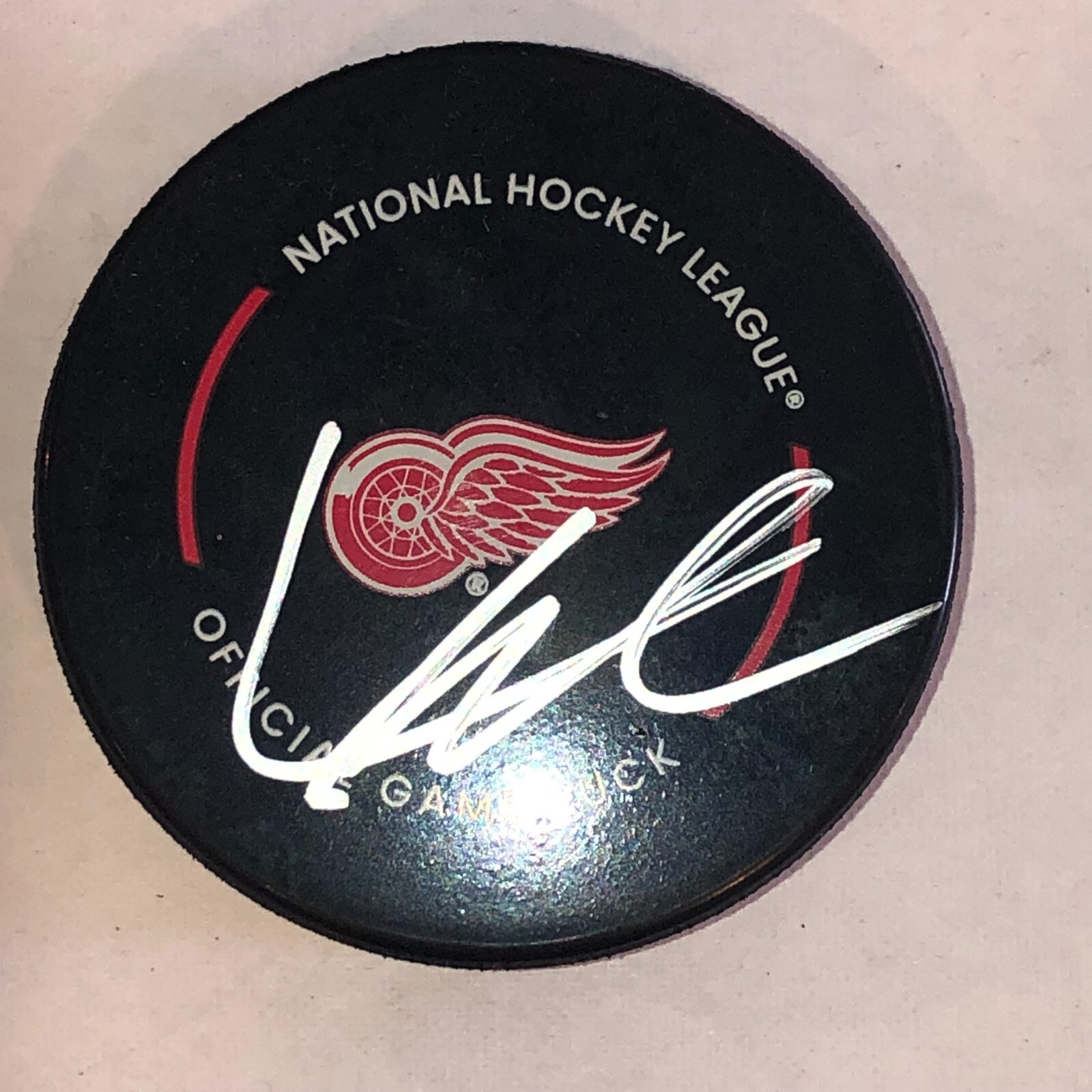 LUCAS RAYMOND Signed Detroit RED WINGS Official GAME Puck Beckett Auth BAS