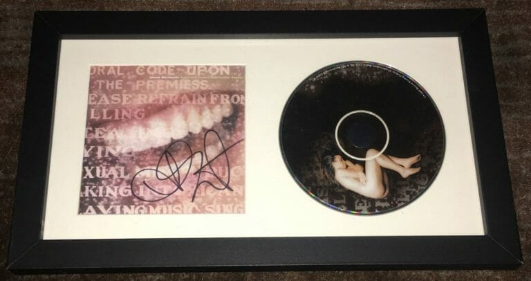 ALANIS MORISSETTE SIGNED SUPPOSED FORMER INFATUATION JUNKIE CD W/EXACT PROOF
 COLLECTIBLE MEMORABILIA