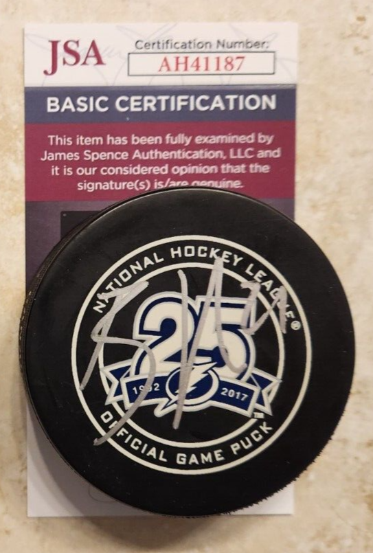 BRAYDEN POINT SIGNED OFFICIAL 25TH ANNIVERSARY NHL GAME PUCK W JSA COA LIGHTNING COLLECTIBLE MEMORABILIA