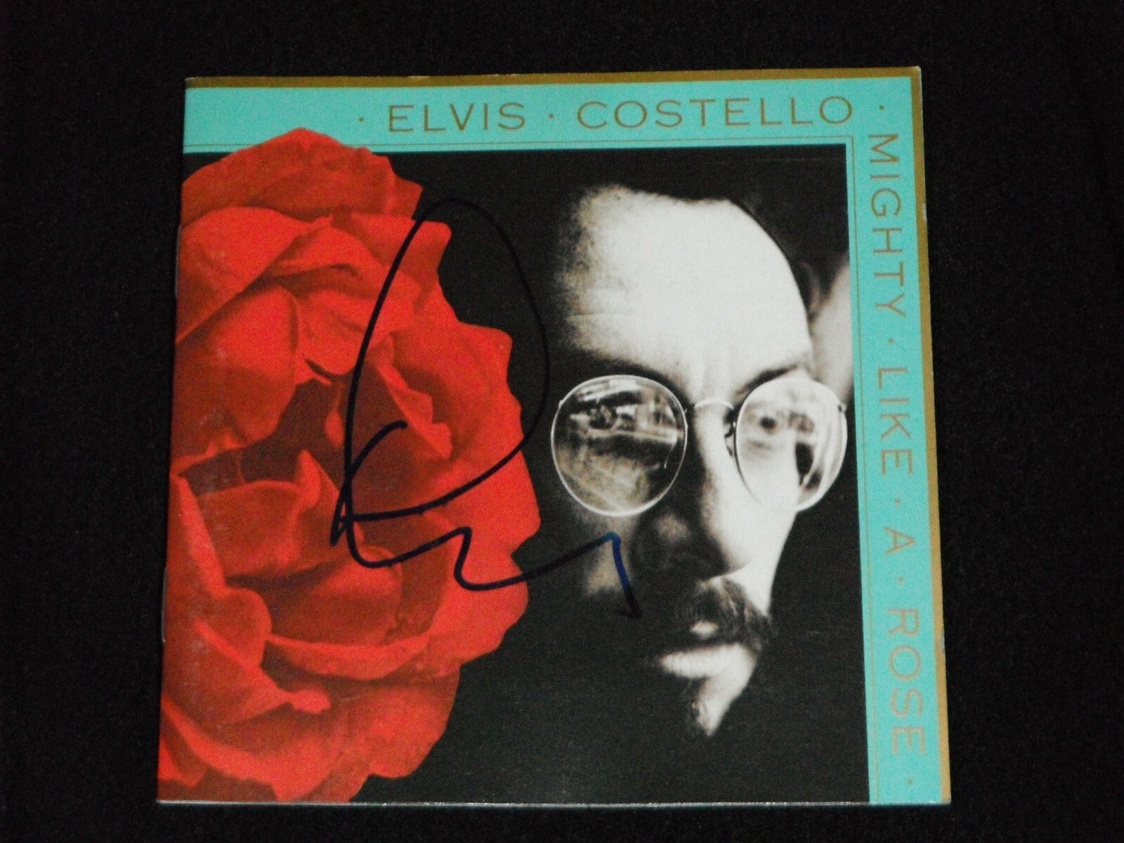 ELVIS COSTELLO SIGNED MIGHTY LIKE A ROSE CD COVER
