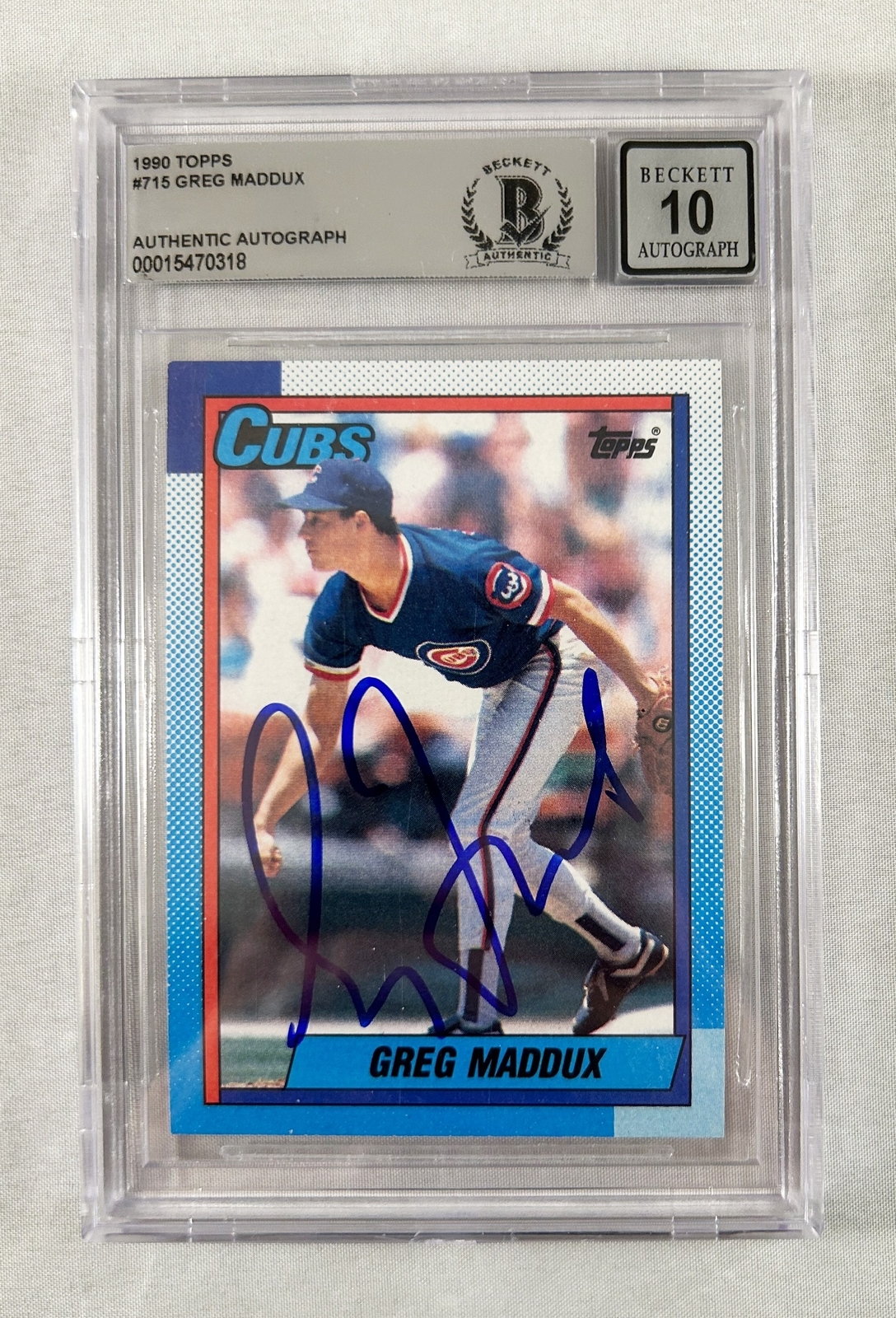 Greg Maddux Signed Trading Card 1990 Topps #715 Beckett BAS COA
