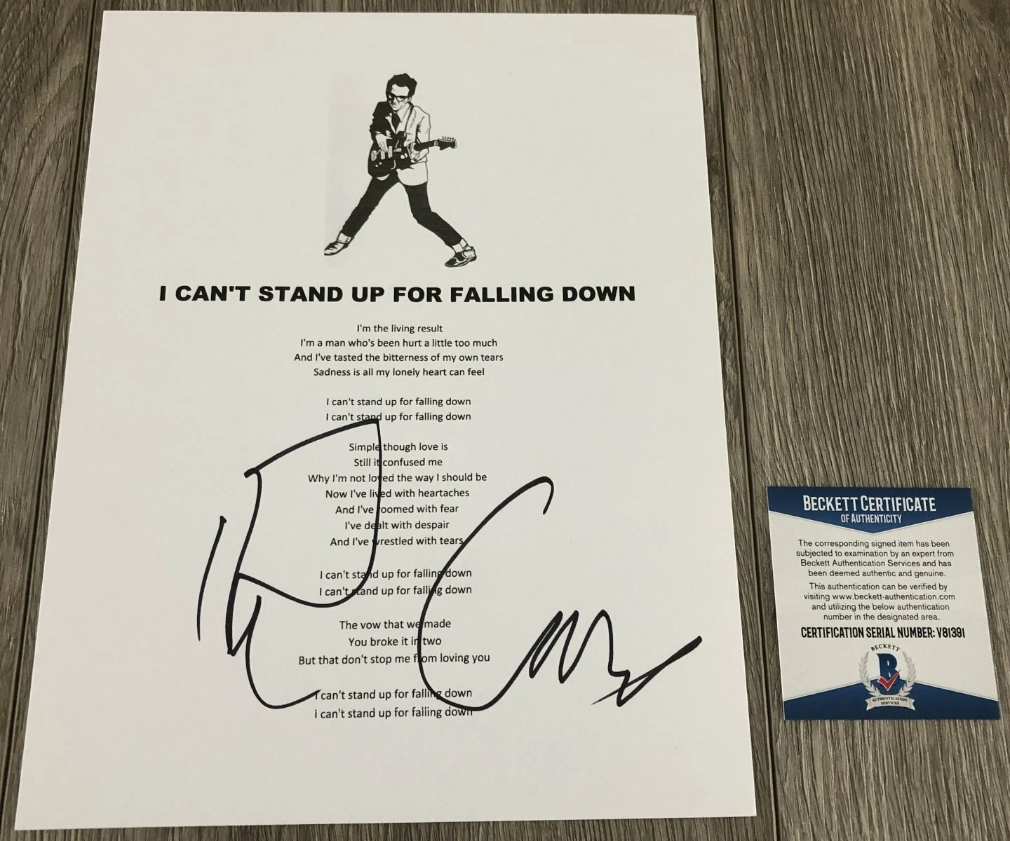ELVIS COSTELLO SIGNED I CAN'T STAND UP FOR FALLING DOWN LYRICS SHEET w/PROOF COA
